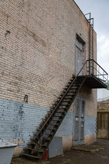metal staircase leading to the second floor of the building