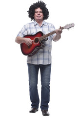 in full growth. a cheerful curly-haired man with a guitar