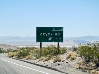 Zzyzx, California: Zzyzx Road exit sign off of Interstate 15. Zzyzx, formerly Soda Springs, is an...