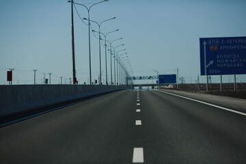 An empty highway stretching into the distance. Road and markings.