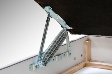 Closeup shot of a lifting mechanism for the bed