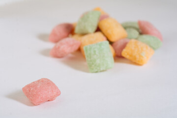 Sweet candy pads on the light background. Mixed of Snack Sugar background. Candy pads close-up