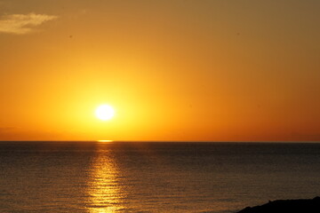 Sunrise over the calm sea