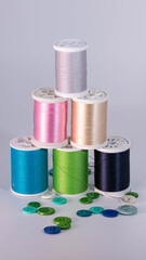 A pyramid of colorful sewing thread