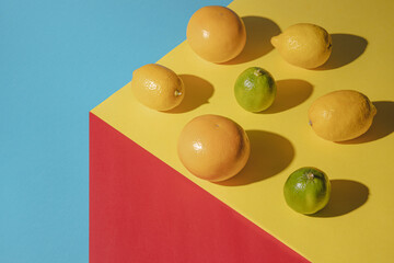 Healty aranger fresh fruit on colorful background. Minimal summer concept.