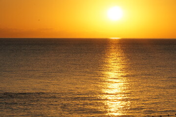 Sunrise over the calm sea