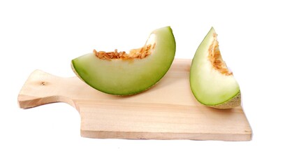 Fresh melon pieces isolated on white background