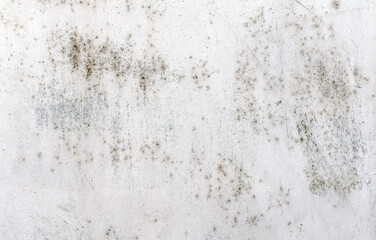 Texture of an old, rusty and scratched metal sheet once covered with white paint