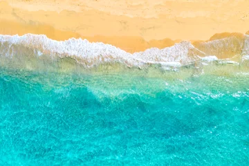  Vacation travel background. Top view aerial drone photo of ocean seashore with beautiful turquoise water and foam sea waves. Caribbean resort. © Nikolay N. Antonov