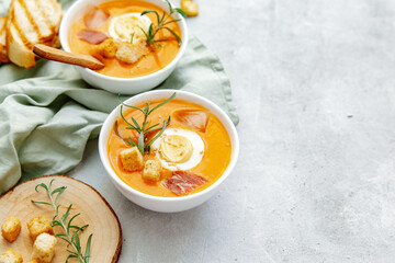 Vegan healthy food. Tomato soup or gazpacho on light  background. Copy space.