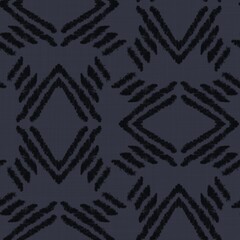 Seamless almost black tribal ethnic rug motif pattern. High quality illustration. Hand drawn symmetric native style design in dark gray and black with texture. Old artisan textile seamless pattern.