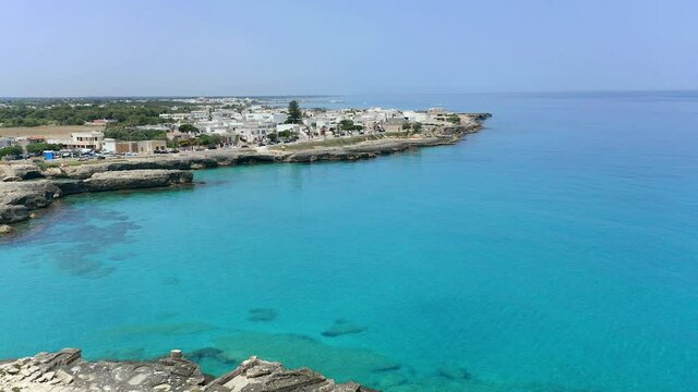 Aerial view, flight at Tower and bay of Roca Vecchia (Torre di Maradico), archaeological sites, Brindisi region, Apulia Italy