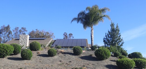 Fototapeta na wymiar Solar panels on top of mountain view house