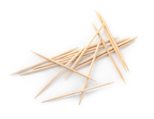 Heap of wooden toothpicks on white background, top view