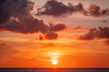 Obraz premium Beautiful colorful sunset or sunrise over sea in summer day. Natural landscape background and wallpaper