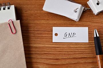 There is a word book with the word GNP written on it. It is an abbreviation for financial term...