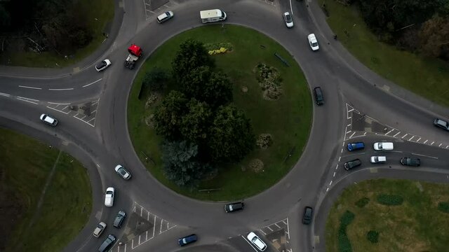 aerial drone timelapse footage for busy roundabout ascending 10sec