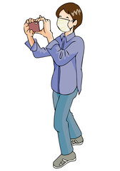 スマホで撮影するマスクした男の子