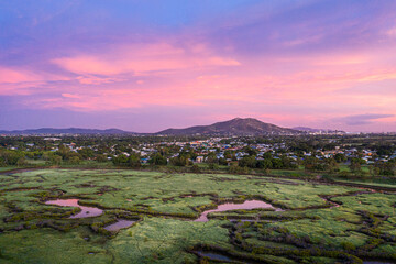 Aerial view of Townsville, Queensland, Australia overlooking Ross River with Castle Hill in the background