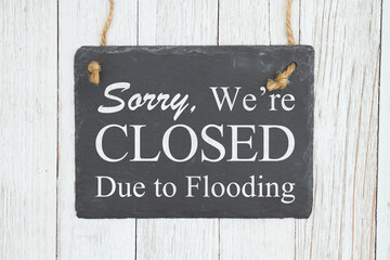 Closed Due to Flooding chalkboard sign