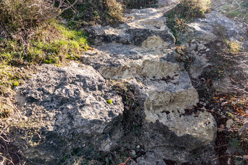 The steps were cut into the rock. The sun shines on the steps in the rock. December in the Crimea near Sevastopol.