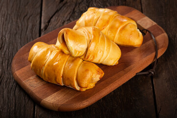 Traditional fresh baked croissants on the table.
