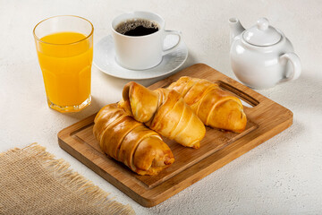 Traditional fresh baked croissants on the table.