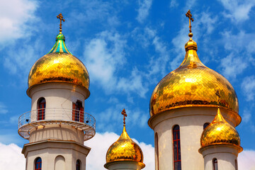 Fototapeta na wymiar Russian Golden Cupola . Domes on the top of Christian church