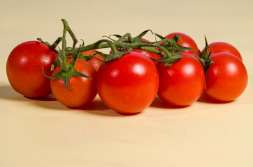 Tomatoes on a blue background with low reflection