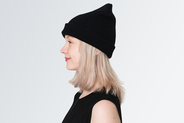 Teenage girl in black beanie profile portrait for street fashion shoot © Rawpixel.com