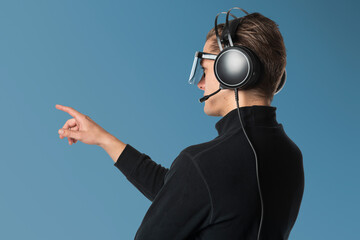 Fototapeta premium Cool man wearing 3D VR mask with headphones
