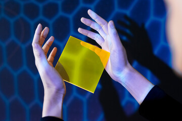 Woman showing yellow interface hologram