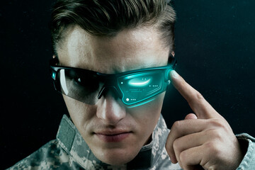 Young military man wearing AR glasses