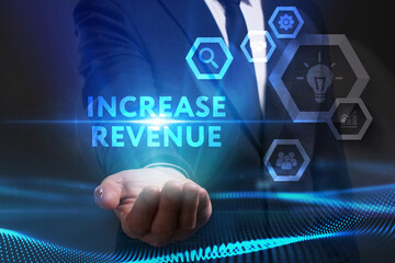 Business, Technology, Internet and network concept. Young businessman working on a virtual screen of the future and sees the inscription: Increase revenue