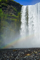 Rainbow over Skogafoss waterfall in Iceland