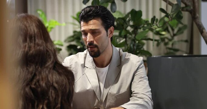 Business woman lawyer or notary with sad man client talking in her office. Law and Legal concept.