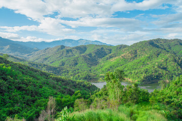 Obraz premium The front view , the long mountains and the lagoon or the reservoir against the clear blue sky. Natural template landscape.