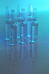  Ampoules with solution for injection. Medicine and
 Pharmacology.Biotechnology and Science.Glass transparent ampoules  on a blue blurred background.Health and beauty.Organic natural cosmetics