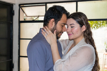 Hispanic couple in love kissing 
