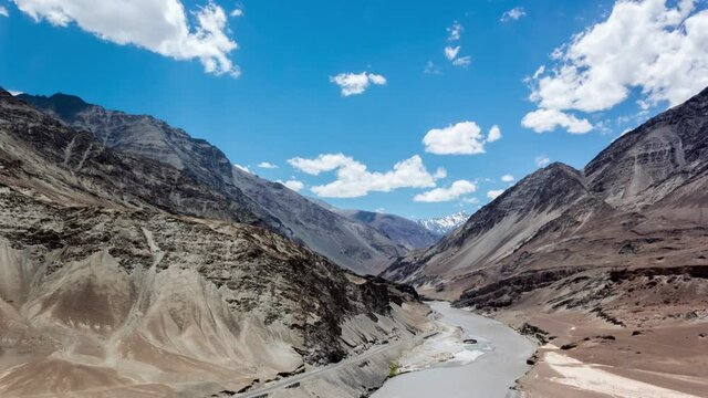 Time Lapse of Beautiful Clouds over Barren Himalaya Mountains & Confluence of Zanskar & Indus Rivers at Sangam, Leh City, Ladakh, India