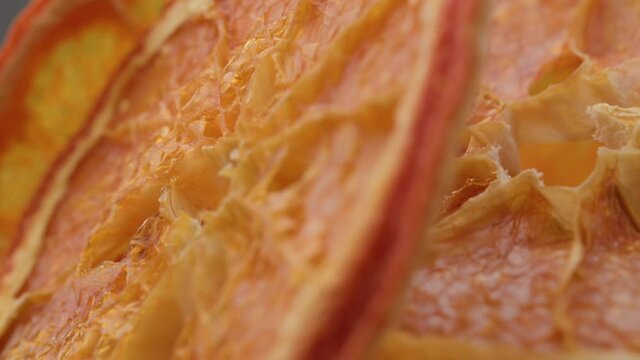 dried mandarine pattern. Dried fruits. Dried orange. Orange slice is rotting. Gift boxe and christmas decorations. dried orange slices on backdrop. Vegetarian fruit chips.