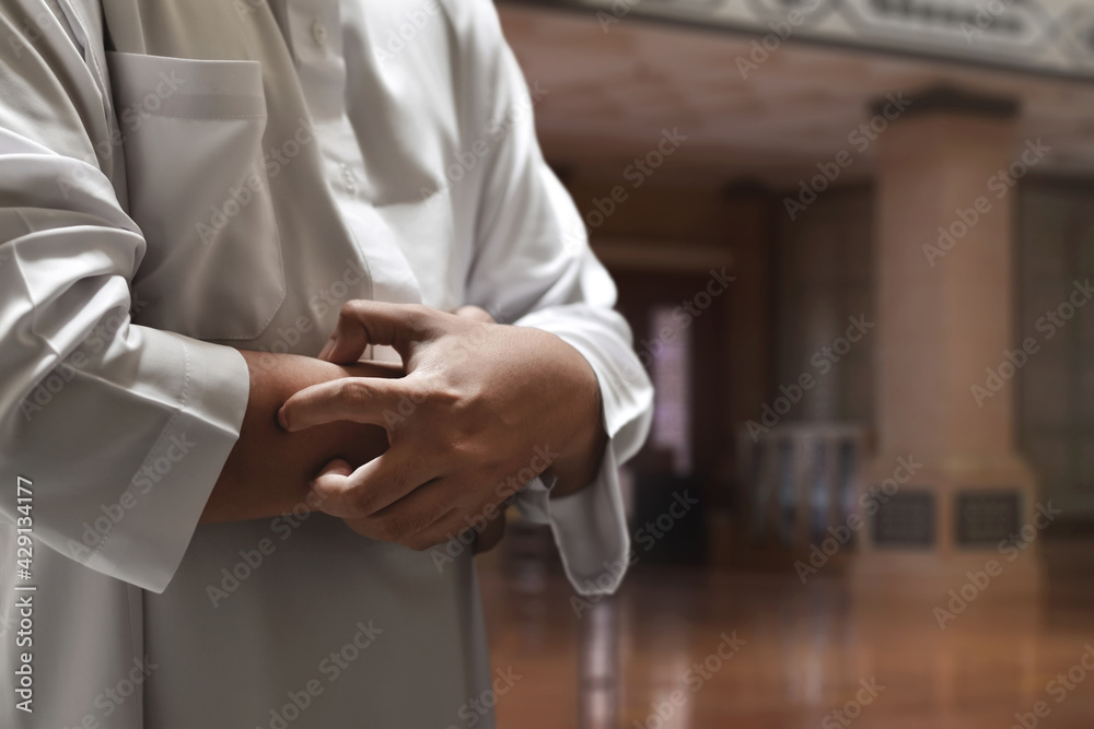 Wall mural Religious asian muslim man praying