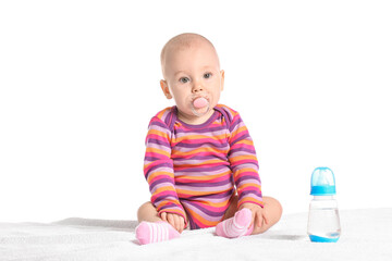 Cute little baby with bottle of water on white background