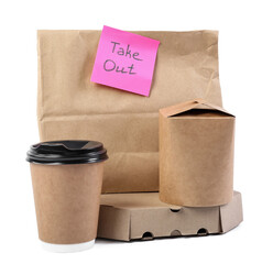 Paper bag with sticker TAKE OUT, boxes for food and cup on white background