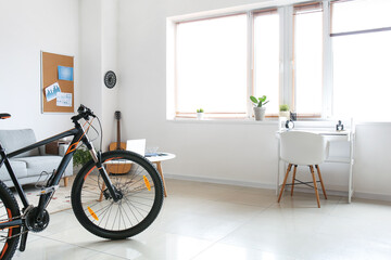 Fototapeta na wymiar Interior of modern living room with bicycle