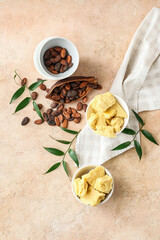 Composition with cocoa butter and beans on color background