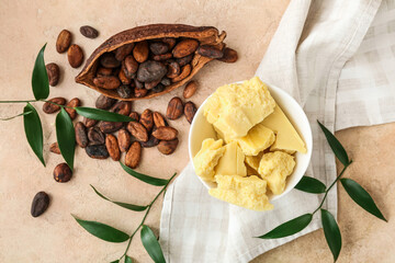 Composition with cocoa butter and beans on color background