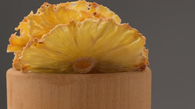 Dried pineapple. Dried pineapples on the table. Dried pineapples on the table.  Rotating Dried Pineapple rings seamless loopable. Dried Pineapple rings seamless. Fresh made Dried Pineapple rings. 
