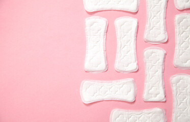Menstrual pad on a pink background.