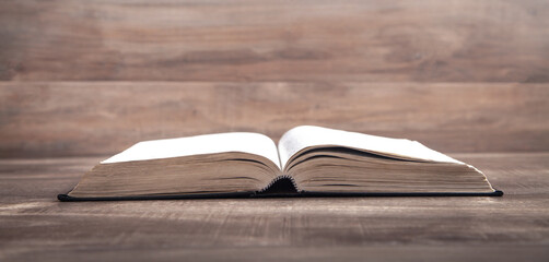 Holy Bible on the wooden table. Religion. Education